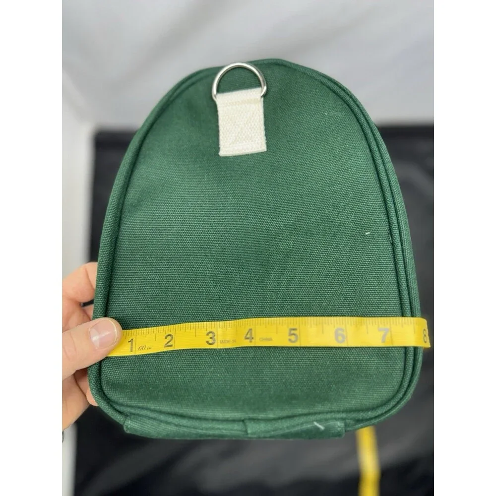 AG1 Duffle Bag Unisex Green Canvas White Handles Accents Adjustable Strap NWOT